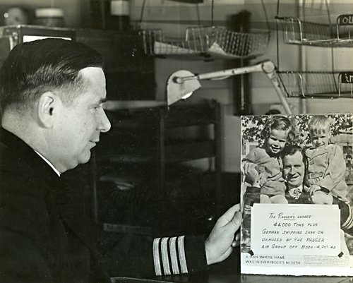 Captain Rowe Views Photo of Von Bulow, USS Ranger Captain Rowe Views Photo of Von Bulow, USS Ranger